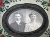 Antique photo of young couple in a hand painted fabric frame - Selective Salvage