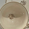 Painted china cup and saucer, floral design, unmarked